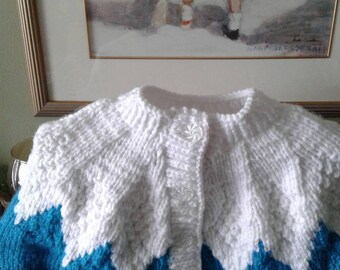 Little Girl's Sweater. Colour is Aqua.