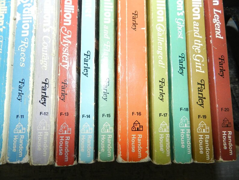 May include: A collection of vintage Farley books, featuring titles like "Stallion Races" and "Stallion Mystery." The spines are in various colors, with the author's name and the publisher, Random House, clearly visible. The books are numbered F-11 through F-20.