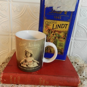 Your Choice/ LINDT CHOCOLAT TIN- 1995 150 Year Anniversary/Mug Made in china