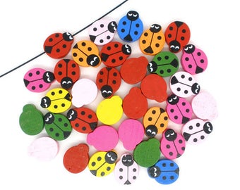 PBois26  - 10 jolies perles   en bois forme coccinelle 19mm x 15mm