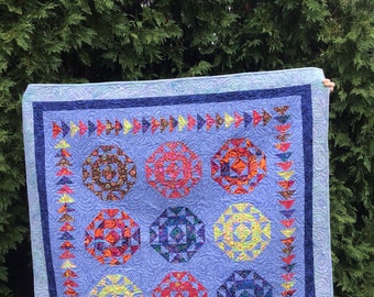 Modern dramatic quilt using mostly Kaffe Fassett fabric