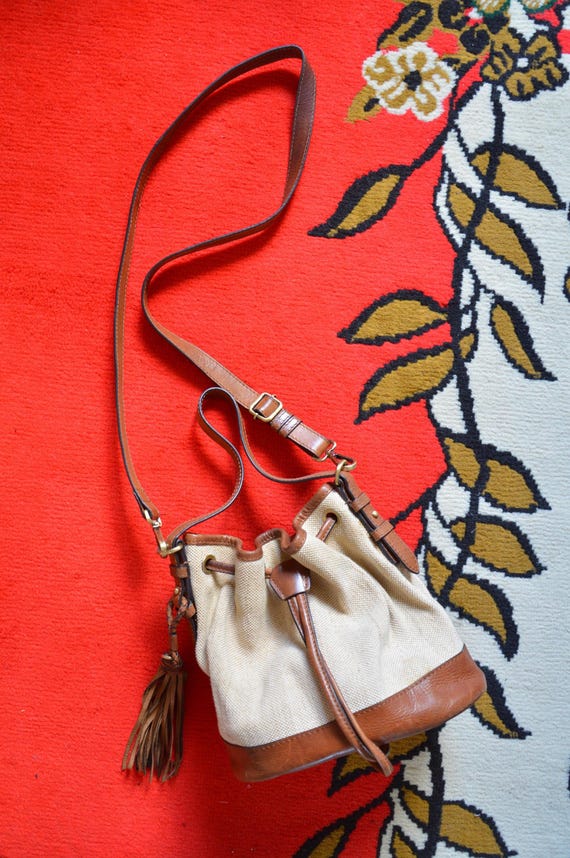 Vintage beige canvas tan brown leather bag // BOHO hippy bucket hobo SLOUCH soft shoulder bag tassel retro minimal timeless 70s 60s handbag