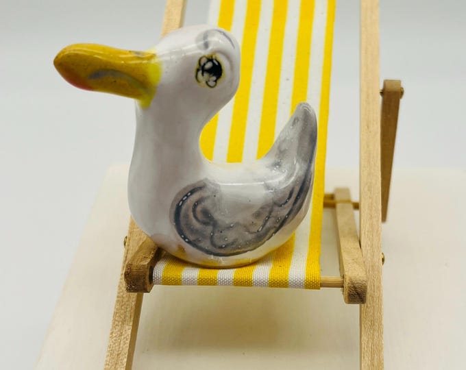 Seagull Pottery Ornament: Quirky Bird on Yellow Deckchair