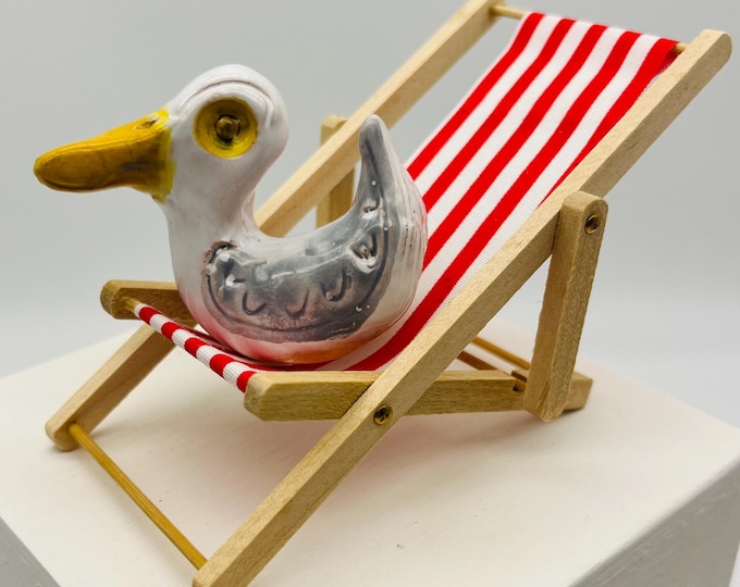 Ceramic Seagull Ornament on Red Deckchair: Quirky Sussex Pottery