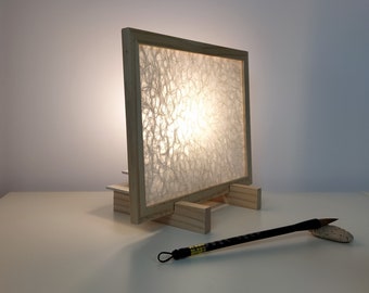 Lamp in raw wood and plant fibers. Natural appearance. Ecru color.