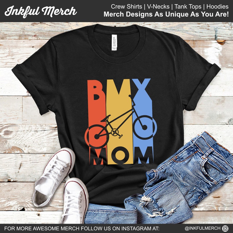May include: Black t-shirt with a retro-style graphic of a BMX bike and the text "BMX MOM".