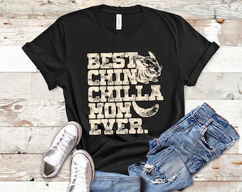 May include: Black t-shirt with a distressed white graphic that says "Best Chin Chilla Mom Ever."  A chinchilla is pictured in the graphic.