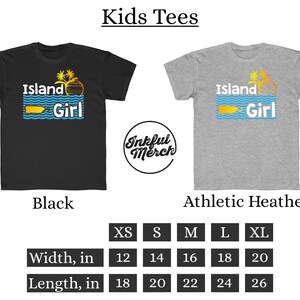 May include: Kids' t-shirt design featuring the text "Island Girl" with a palm tree and a sun graphic. The shirt is available in black and athletic heather colors. Size chart shows width and length measurements in inches for sizes XS, S, M, L, and XL.