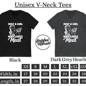 May include: Black and dark grey heather unisex V-neck t-shirt with the text "Just a girl who loves meat" and a retro illustration of a woman holding a piece of meat. The shirt is available in sizes XS-3XL. The size chart shows the width and length of the shirt in inches.