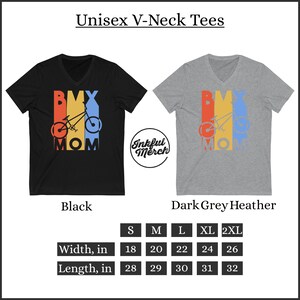 May include: Black and dark grey heather unisex V-neck t-shirts with a retro-style graphic of a BMX bike with the word "MOM" underneath. The graphic is in red, yellow, blue, and orange. The size chart shows the width and length in inches for sizes S, M, L, XL, and 2XL.