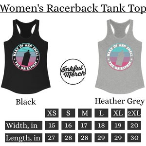 May include: Black and heather grey racerback tank top with the text "Wake Up and Smell the Hairspray" in a circle with a pink, blue, and white gradient. The tank top is available in sizes XS-2XL. The size chart shows the width and length in inches.