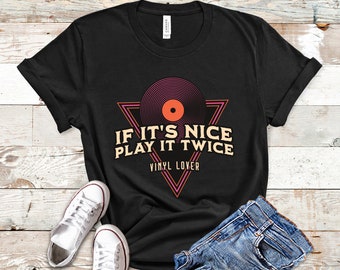 May include: Black t-shirt with a pink and orange vinyl record graphic and the text "If it's nice play it twice vinyl lover".
