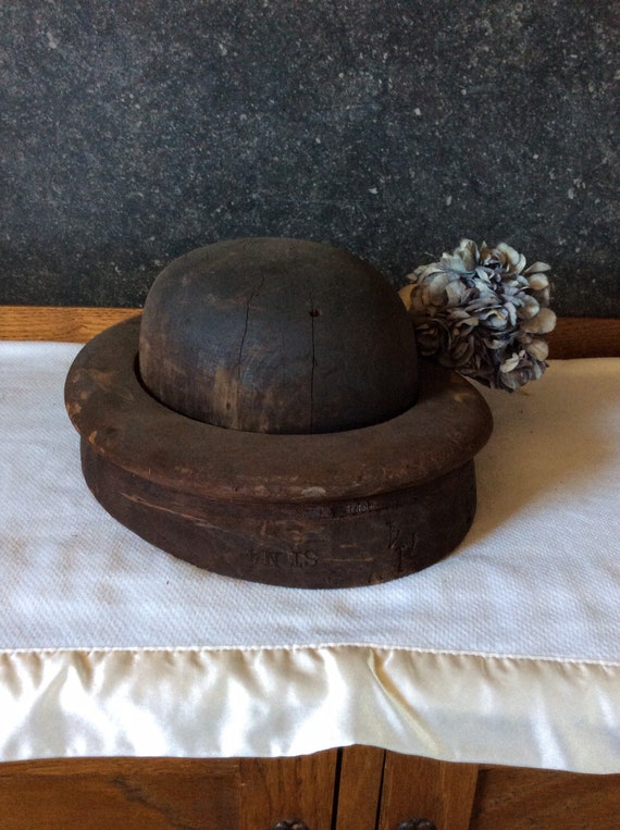 Antique hand carved hat form with tool