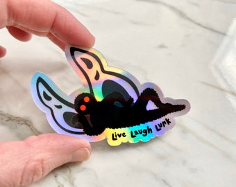 Holographic Mothman Original Live Laugh Lurk sticker