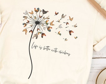 May include: A white t-shirt with a dandelion design featuring a variety of chickens. The text "Life is better with chickens" is printed below the dandelion.