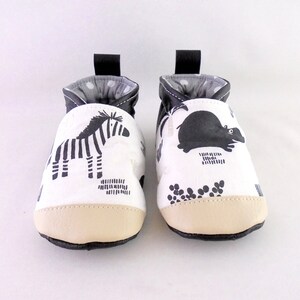 slippers in black imitation leather and savannah animal fabric image 1