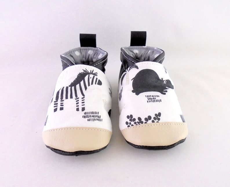 slippers in black imitation leather and savannah animal fabric image 1