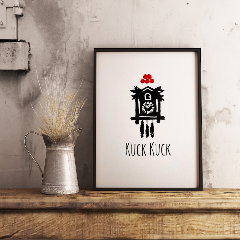 May include: Black and white illustration of a cuckoo clock with red berries on top. The clock face reads "Kuck Kuck".