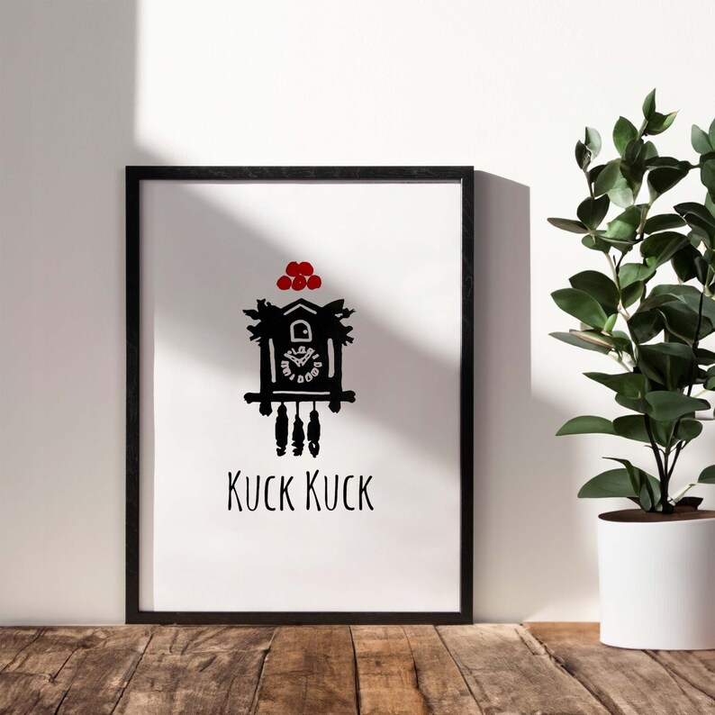May include: Black and white illustration of a cuckoo clock with red accents. The clock is framed and the text "KUCK KUCK" is below the clock.