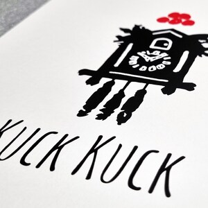 May include: Black and white illustration of a cuckoo clock with red accents. The clock has a face with Roman numerals and a pendulum. The text "KUCK KUCK" is written below the clock.