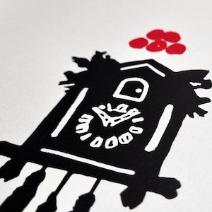 May include: Black and white illustration of a cuckoo clock with a red circle design above it. The clock face has a simple design with black hands and white numbers.