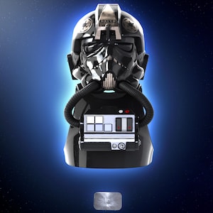 May include: A black TIE fighter pilot helmet with a glossy finish, featuring a detailed design with a breathing apparatus and control panel. The helmet is set against a blue gradient background with a starry effect.