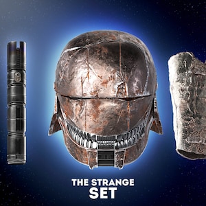 May include: A set of three Star Wars themed items: a lightsaber, a helmet, and a gauntlet. The helmet is rusty and has a menacing look. The gauntlet is also rusty and has a worn look. The lightsaber is black and has a silver handle. The text "THE STRANGE SET" is below the items.
