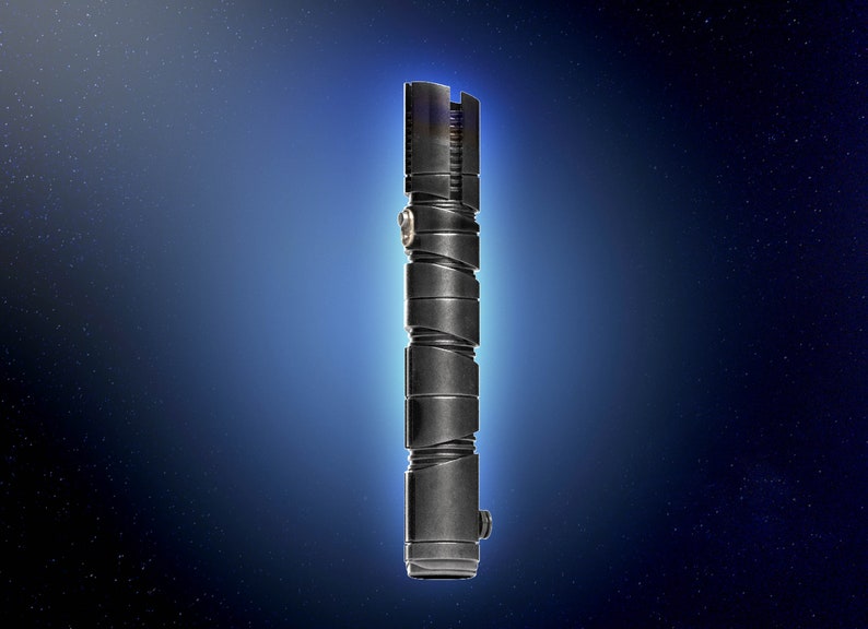 May include: A black lightsaber hilt with a silver accent. The hilt is made of metal and has a textured surface.