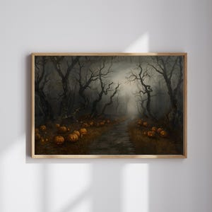 May include: A framed Halloween-themed print depicts a spooky forest scene. Bare, dark trees line a path illuminated by glowing jack-o'-lanterns. The artwork has a muted color palette with a foggy, atmospheric effect, creating a haunting ambiance.