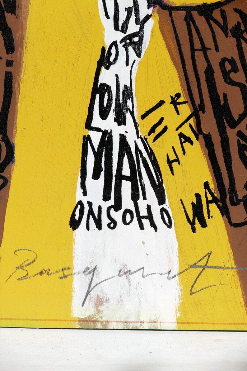 May include: A yellow, white, and brown abstract painting with black text that reads "I've got you, man = r, half, and walk on soho". The painting is signed "Beu".