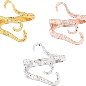 May include: Three silver, gold, and rose gold octopus tentacle rings. The rings are made of metal and have a textured surface.