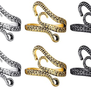 May include: Six silver, gold, and black octopus rings. Each ring features a detailed octopus design with textured tentacles.