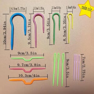 May include: Set of 10 colorful plastic crochet hooks and needles in various sizes, including 3.94 inches, 3.74 inches, 3.54 inches, 3.35 inches, 3.5 inches, 3.8 inches, and 4 inches. The hooks and needles are labeled with their measurements in both inches and centimeters.