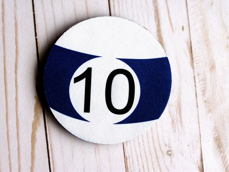 May include: A white and blue round pool ball with the number 10 printed in black.