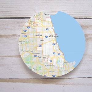 May include: A map of Chicago and surrounding suburbs, including Oak Park, Cicero, Bridgeview, and Oak Lawn. The map is circular and has a blue background representing Lake Michigan.