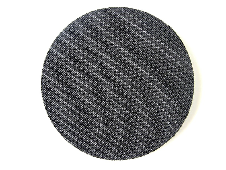 May include: A black, round, textured sanding pad.