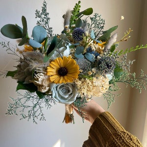 Light blue light grey and yellow wild flower bouquet, sola wood flowers, blue wedding bouquet