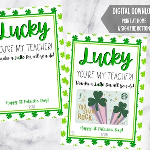 May include: Two St. Patrick's Day cards with green shamrock borders and the words "Lucky, You're My Teacher! Thanks a Latte for all you do!" One card includes a gift card. The cards say "Happy St. Patrick's Day!"