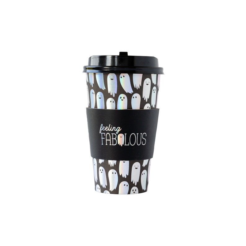 May include: Black and white reusable coffee cup with a ghost pattern and a black sleeve that says "feeling fabulous".