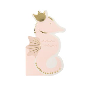 May include: A pink seahorse-shaped party napkin with a gold crown, fins, and decorative dots. The seahorse has a light pink body with gold accents and a white belly. The napkin is designed for a party or celebration.