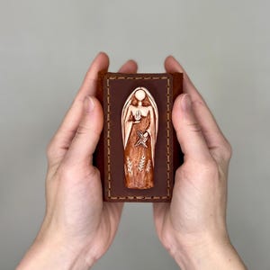 Brigid Statue, Sculpture of Brigid in a case