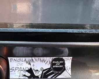 May include: A black and white sticker with a cartoon character with spiky hair and a speech bubble that says "English or Spanish".