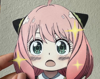 May include: A pink anime character with green eyes and black cat ears. The character has a surprised expression and is surrounded by sparkling stars.