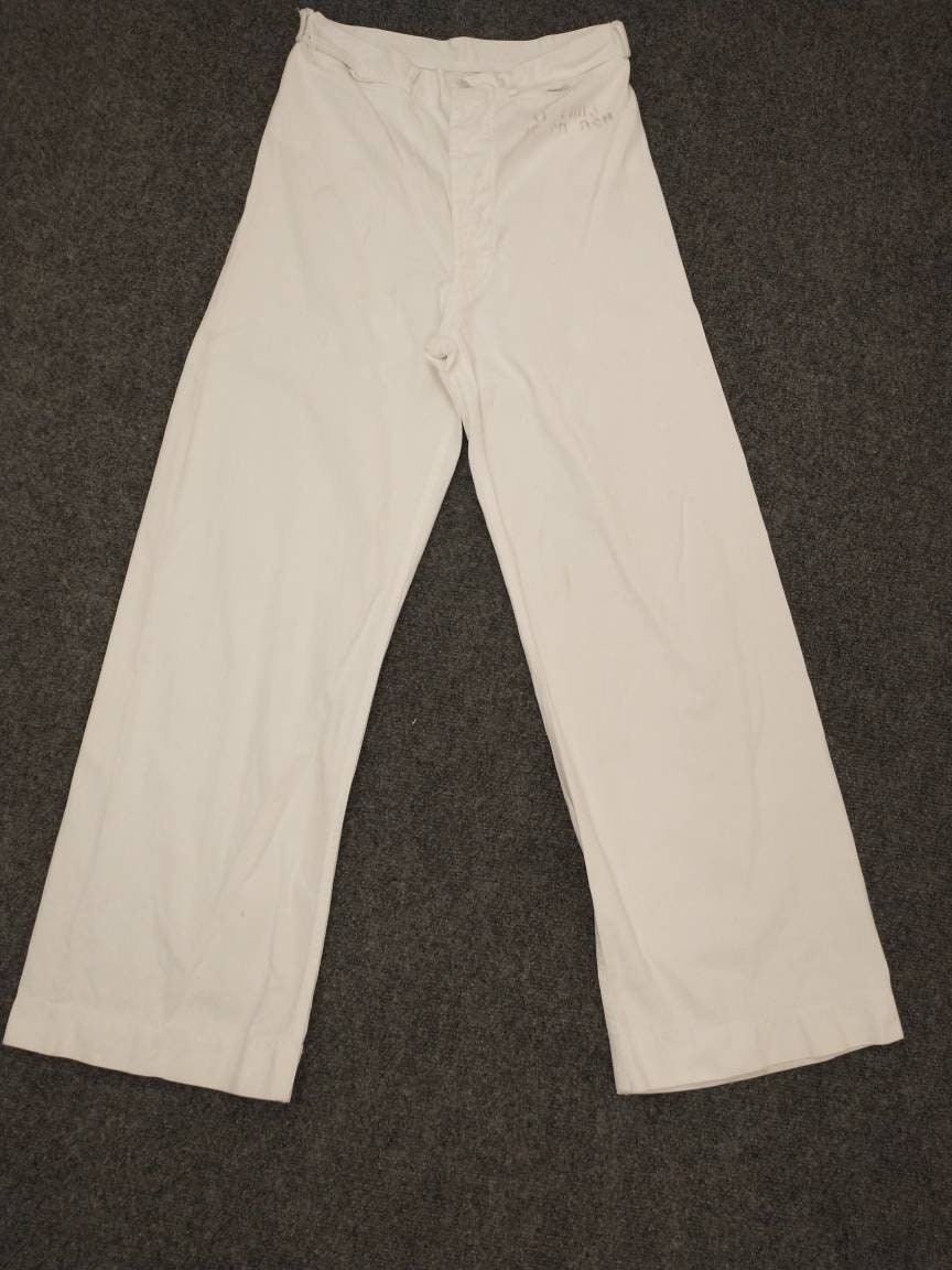 white sailor pants with gold buttons