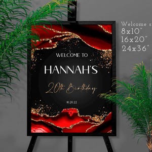May include: A black framed welcome sign for Hannah's 20th birthday, featuring a black background with red and gold accents. The sign includes the text "WELCOME TO HANNAH'S 20th Birthday 10.20.22". Available sizes are 8x10", 16x20", and 24x36".