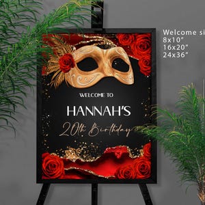May include: A black framed welcome sign for a 20th birthday, featuring a gold mask, red roses, and gold glitter accents. The sign reads "Welcome to Hannah's 20th Birthday" in elegant script. Available in 8x10", 16x20", and 24x36" sizes.