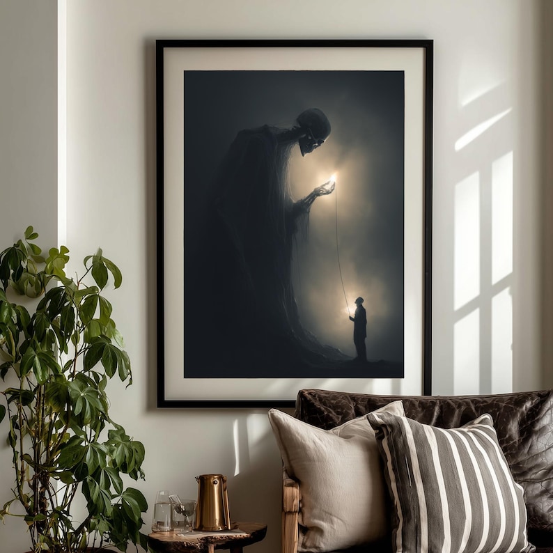 May include: Framed art print depicting a surreal scene with a large, shadowy figure offering a glowing orb to a smaller figure. The artwork is set against a dark, atmospheric background, creating a dramatic contrast. The print is displayed in a black frame.