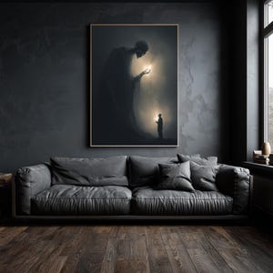 May include: A framed art print depicts a surreal scene with a large, shadowy figure holding a glowing orb connected to a smaller figure. The artwork is set against a dark, textured wall above a gray leather sofa.