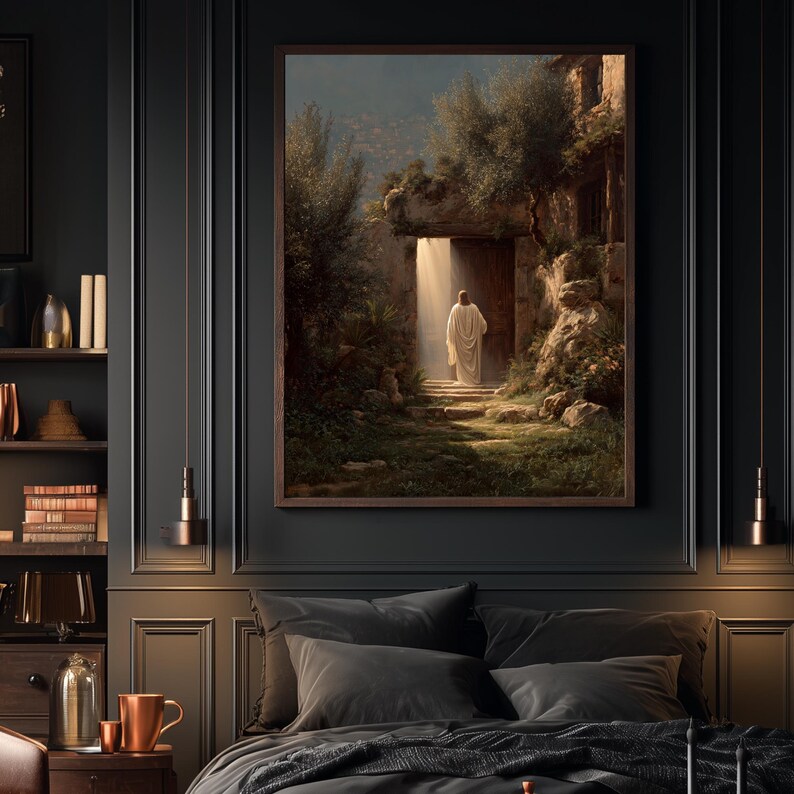 May include: A framed art print depicts a figure in white robes walking towards a bright doorway. The artwork, set in a stone structure with lush greenery, is framed in a dark wood. The scene is illuminated by a beam of light.