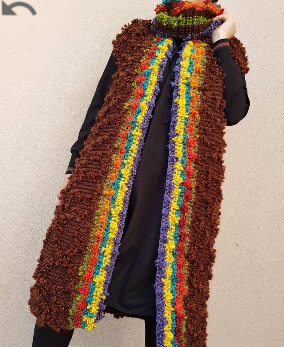 Long hand-knitted brown coat and sleeveless collar with traditional motifs